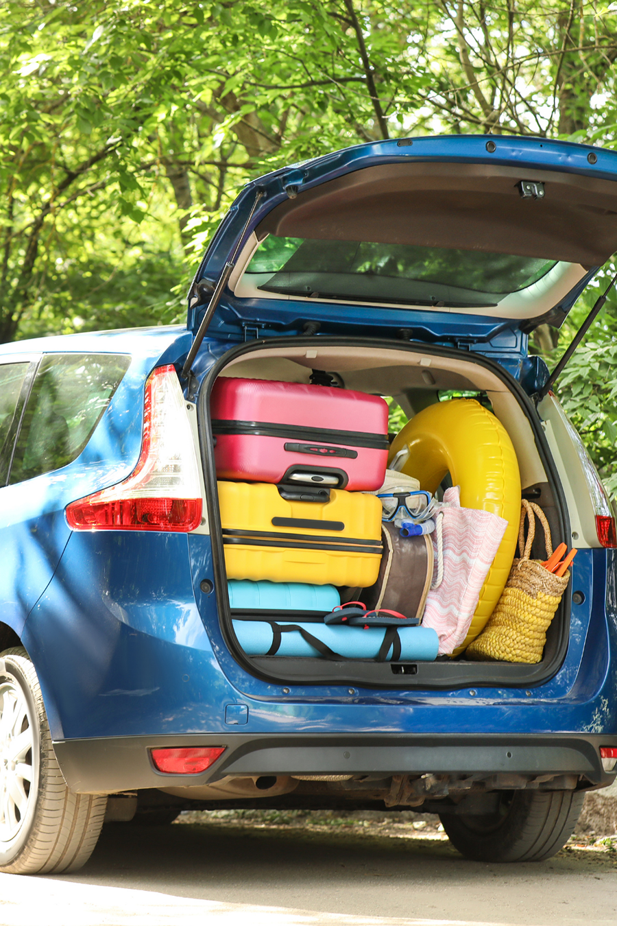 car boot packed with suitcases