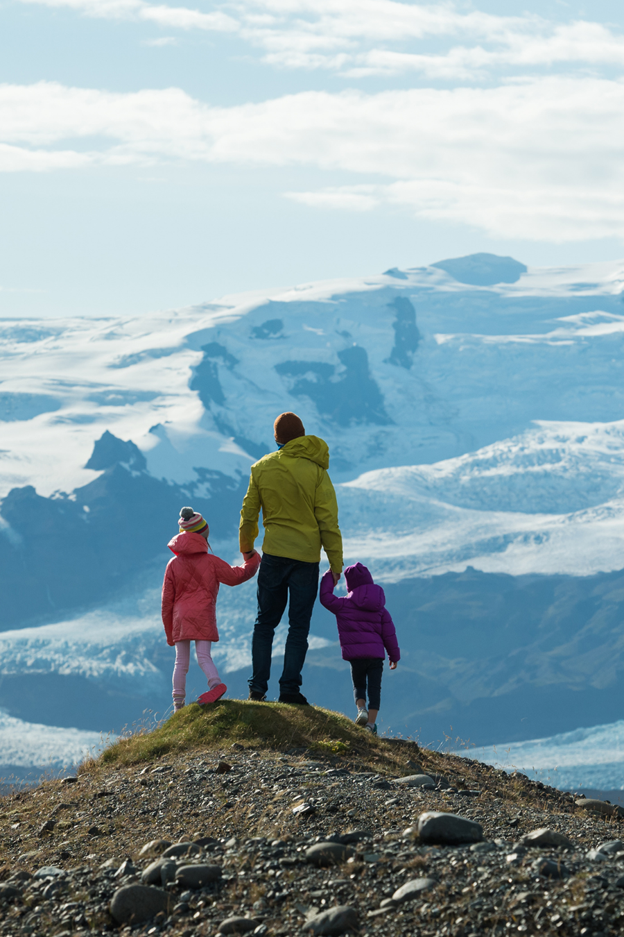 family looking at snow mountain