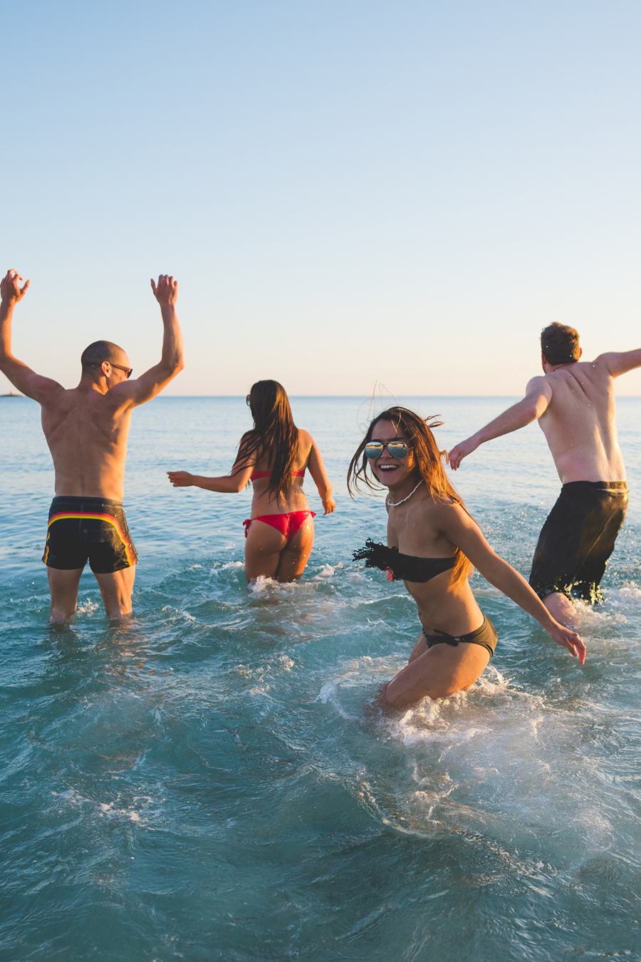 group of people swimming at the beach