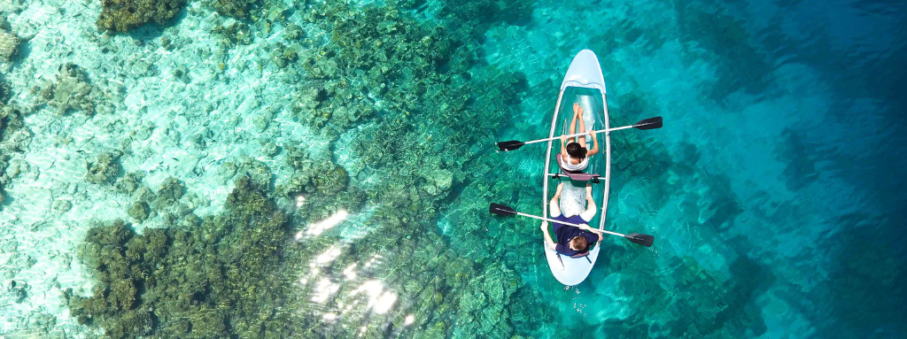 two people kayaking in ocean