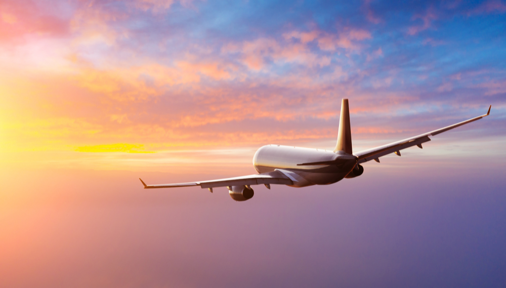 plane in colourful sky
